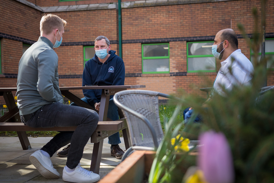 Ben Mee, Neal Ashurst and Ilyas Adam chat in NHS Charities Together funded garden.