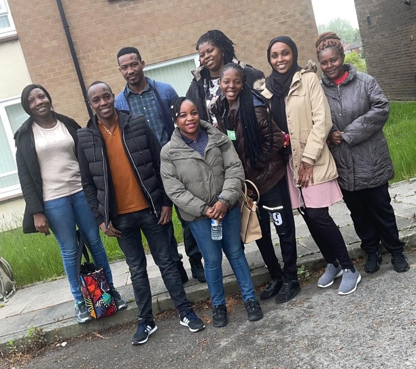 Eight international nurses stand together before their final training courses