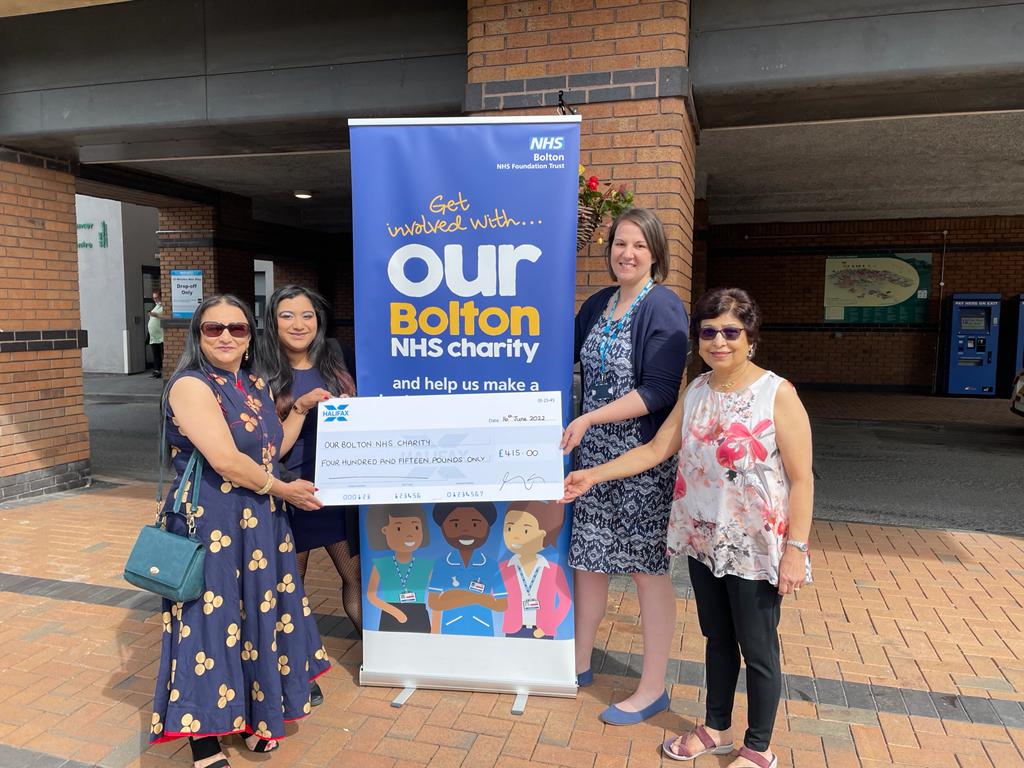 Cheque presentation between Vina Tailor, Dee Tailor, Sarah Skinner and Indira Tailor