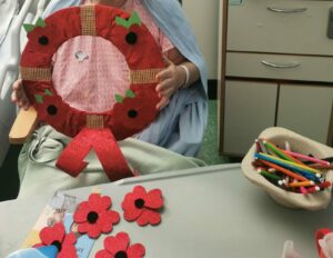 A patient creates a wreath to commemorate Queen Elizabeth II
