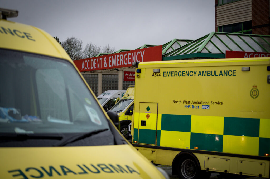 Multiple ambulances parked outside Royal Bolton Hospital's emergency department