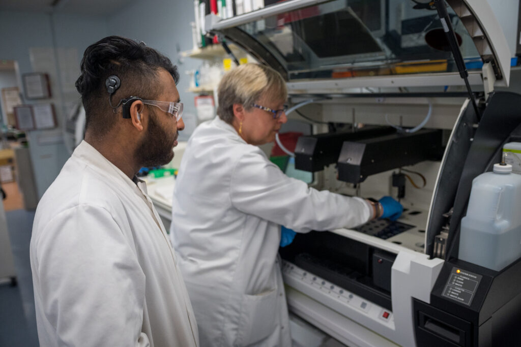 Two Bolton scientists working at a machine in one of Bolton's laboratories. Picture is being used to illustrate the new Bolton blood booking system