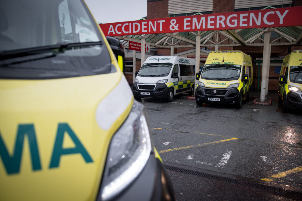 Ambulances wait outside Royal Bolton Hospital's Emergency Department in the rain