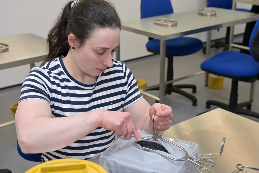 A young doctor learns surgical skills