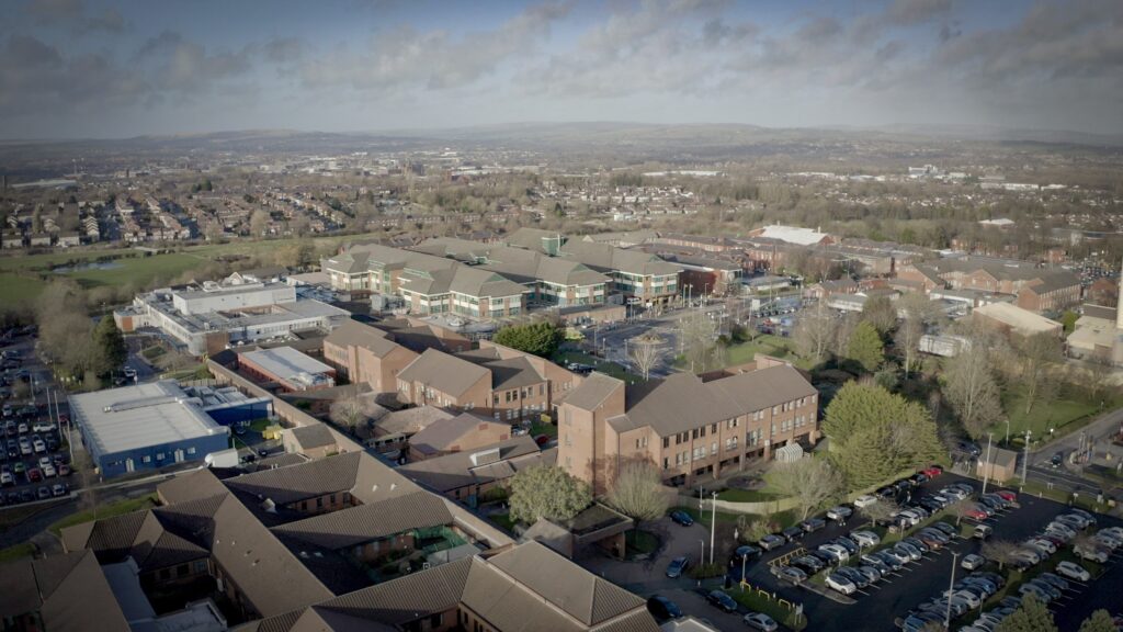 Aerial view of Royal Bolton Hospital with Bolton in the background