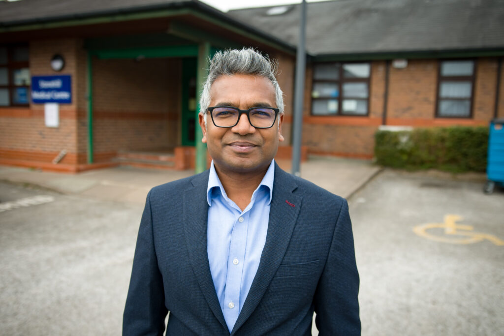 Dr. Niruban Ratnarajah stood outside his GP practice