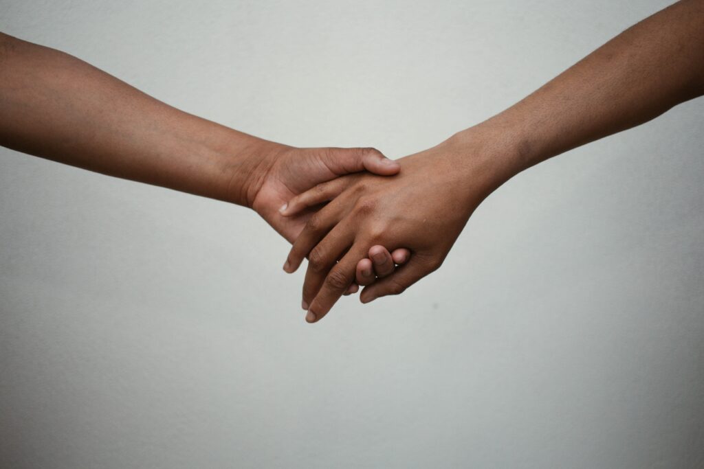 Stock image of holding hands