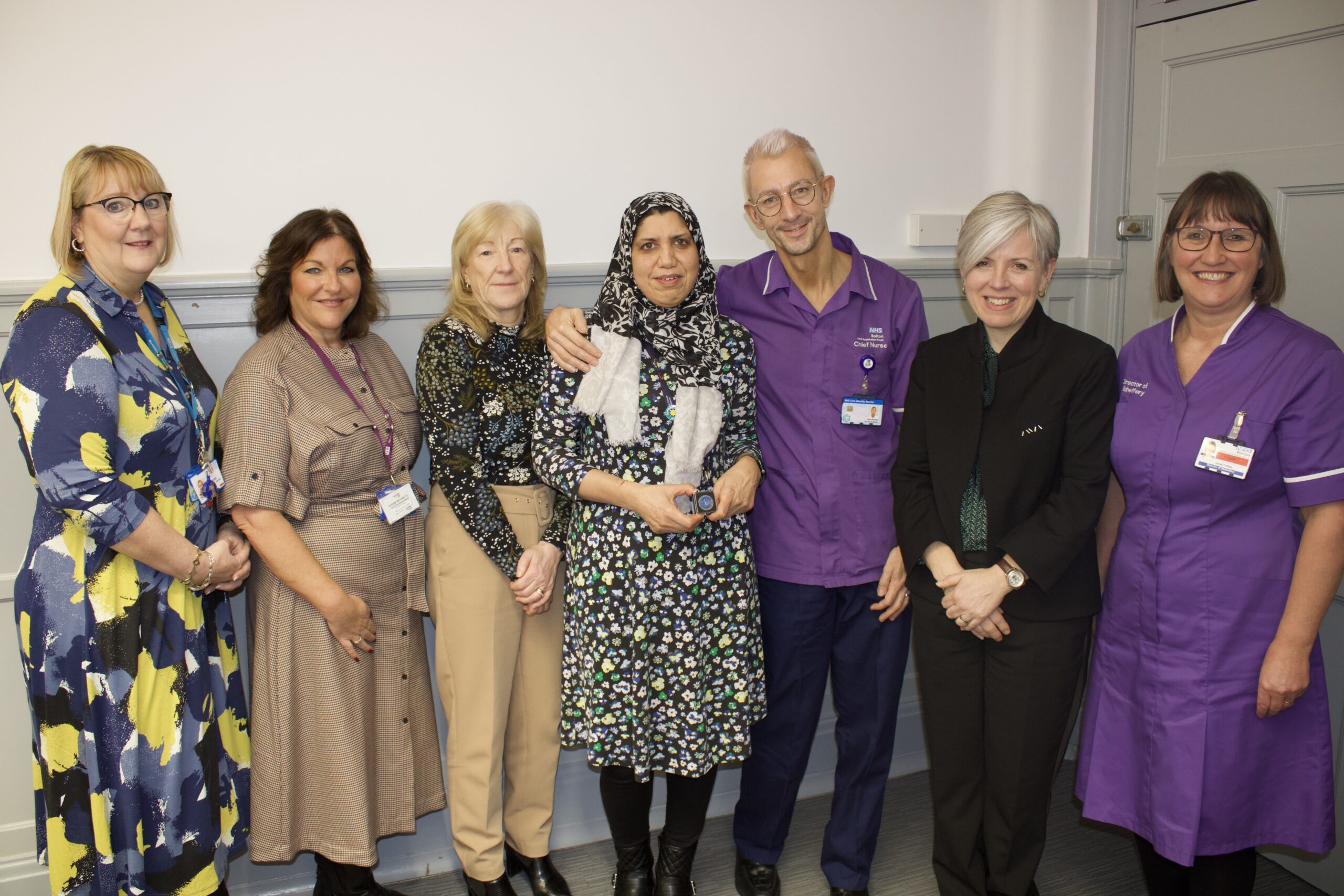 Waheeda Abbas is joined by colleagues after being presented with a Silver Chief Midwifery Award