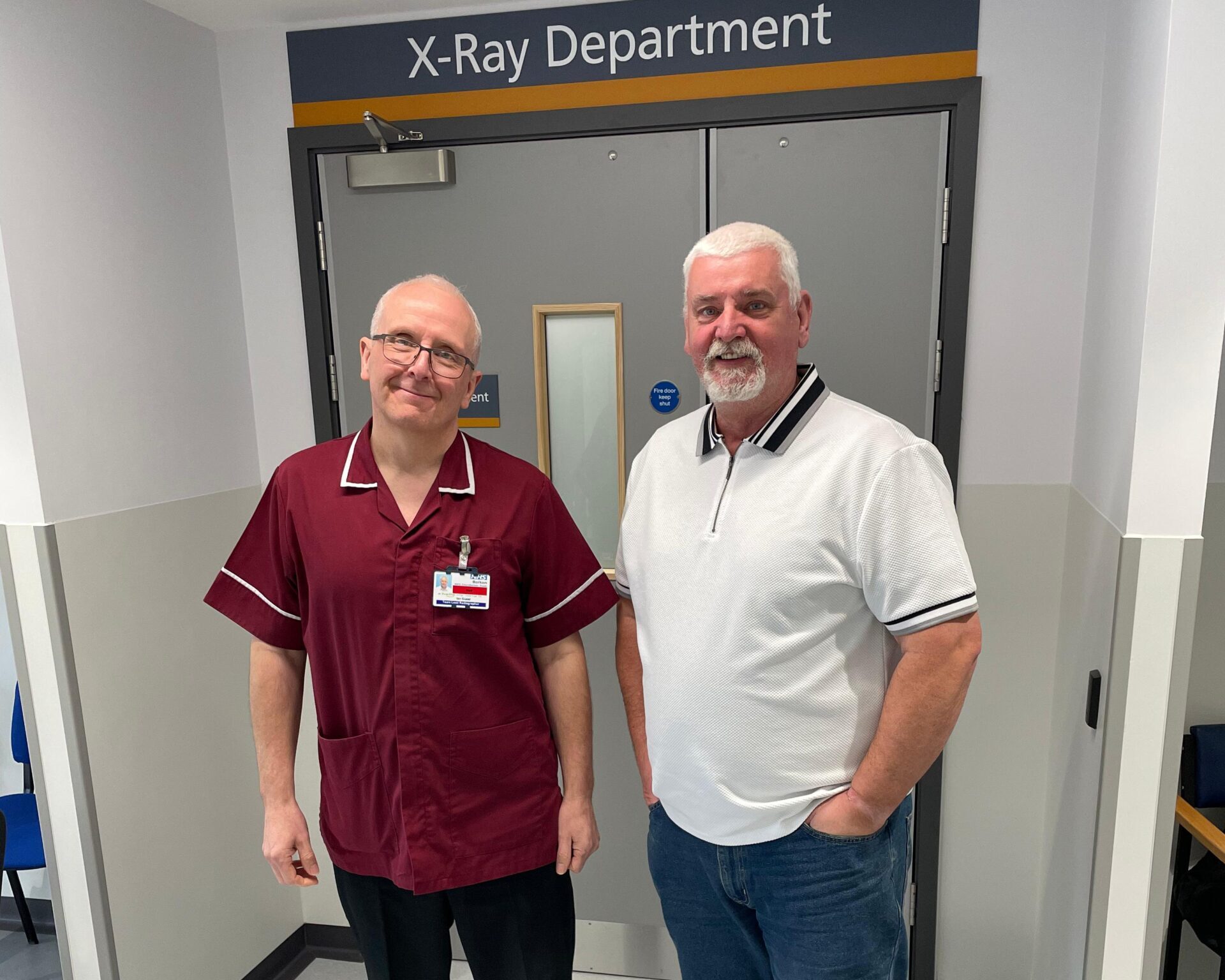 Ian Guest and first X-Ray patient Eric have a picture outside the X-Ray Department in Bolton's CDC