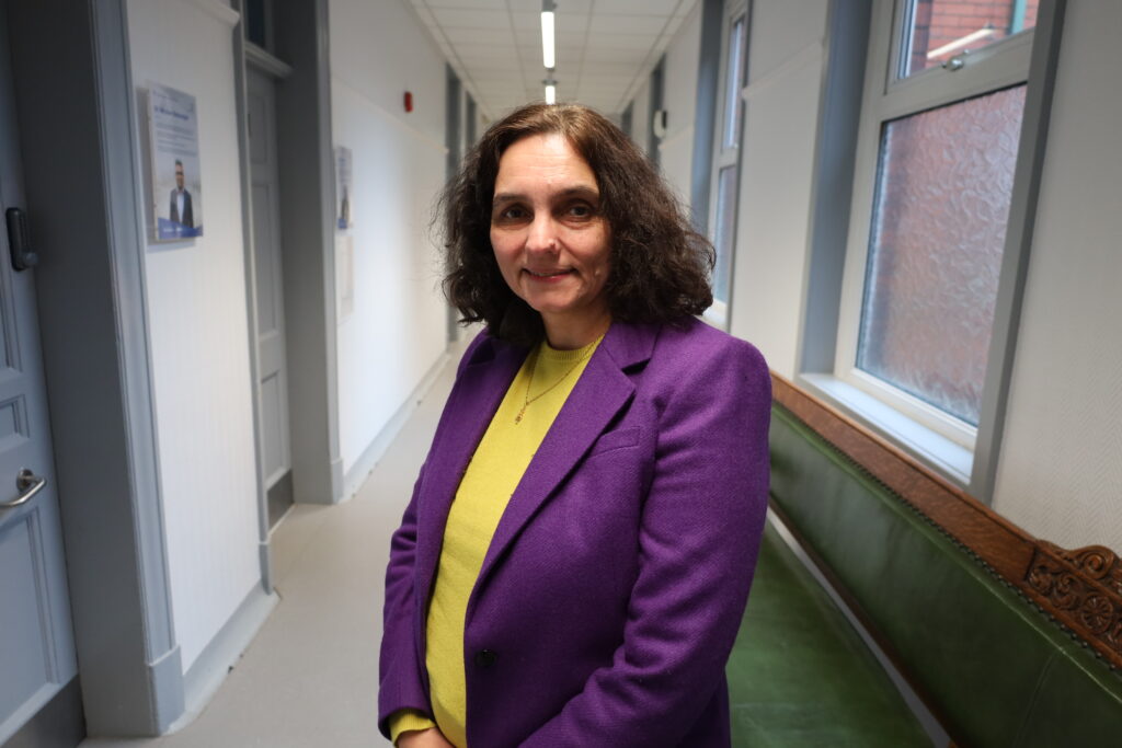 Gita Bhutani in Trust HQ corridor