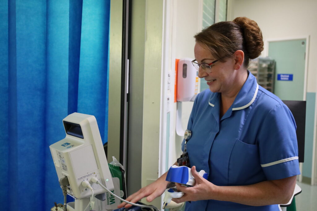 Lindsay O'Malley uses a medical device on Ward D3