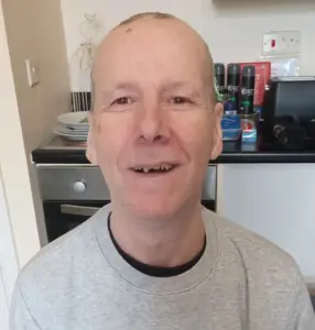 Michael with a haircut and clean shaven