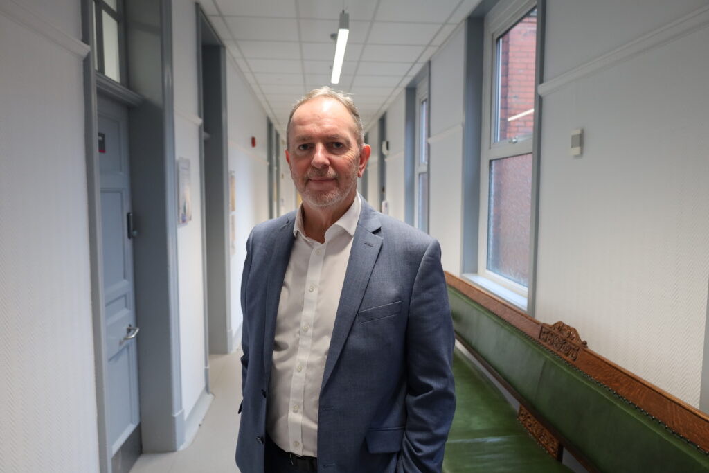 Tony Allen in Trust HQ corridor