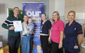 Jess, Matt and Arthur Denney receiving thanks for charity fundraising