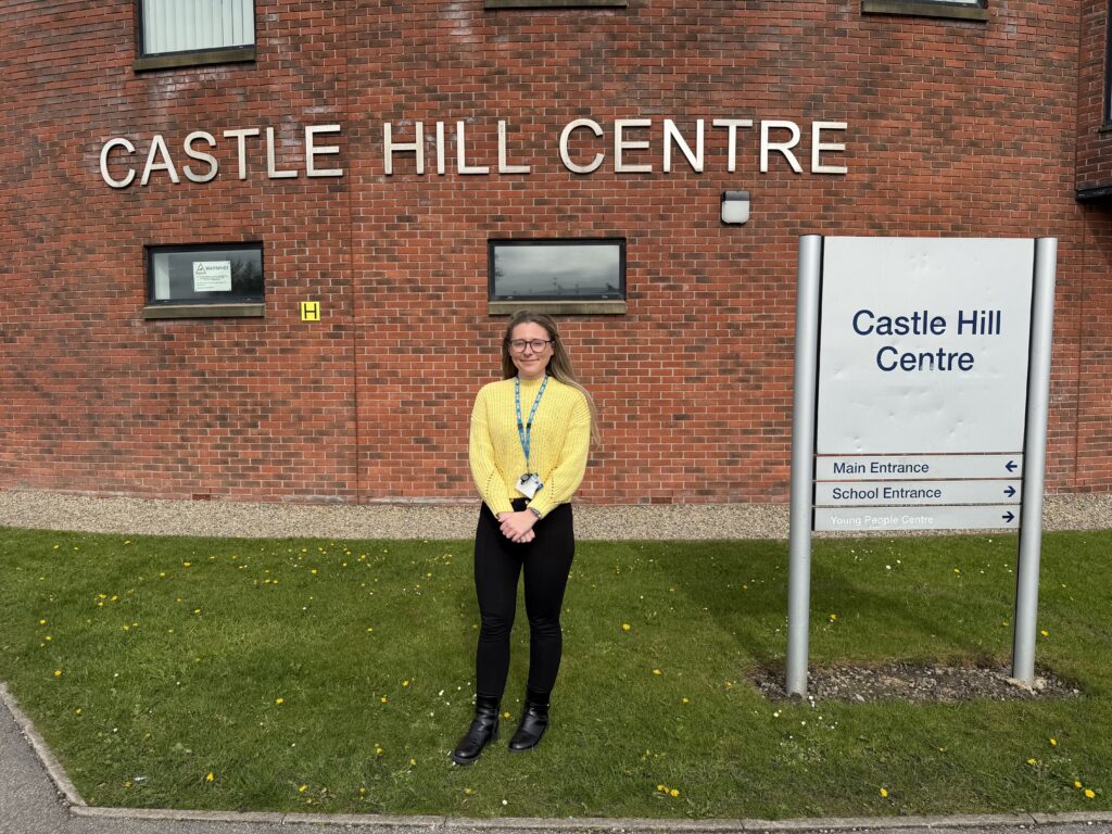Oliva Poulsom smiles for a picture outside Castle Hill Centre in Bolton