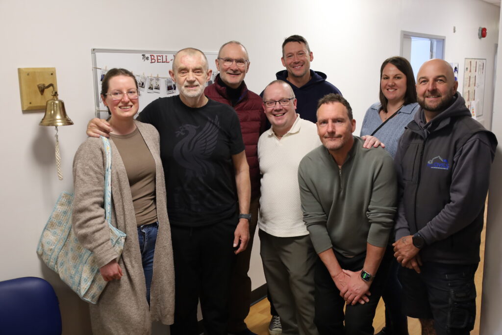Gareth Price smiles for a picture with his family and friends