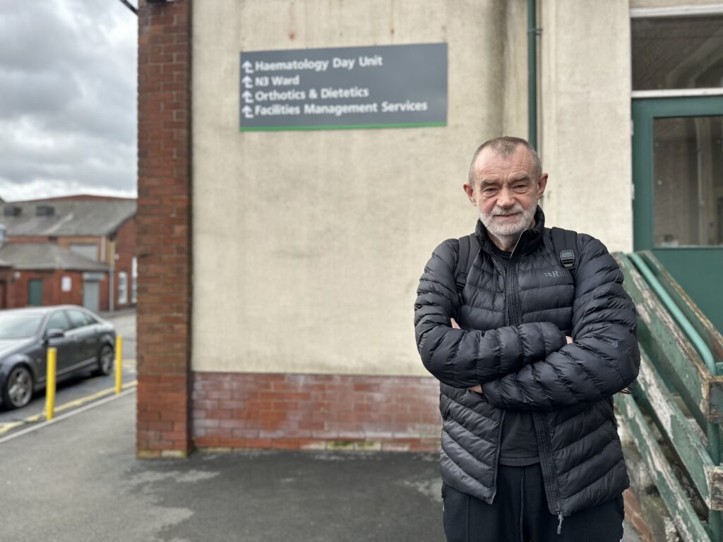 Gareth Price standing outside N Block at Royal Bolton Hospital