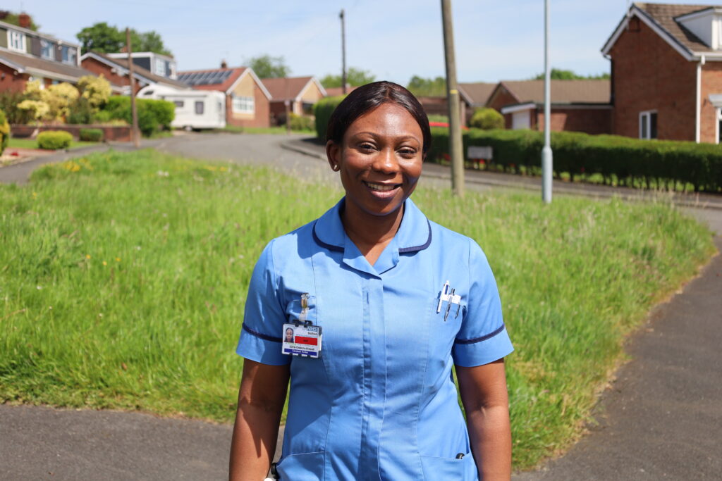 Community nurse Esther on street in Bolton