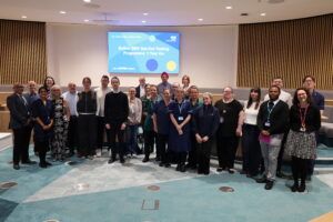 Group picture of teams involved in Bolton NHS Foundation Trust's BBV opt-out testing programme