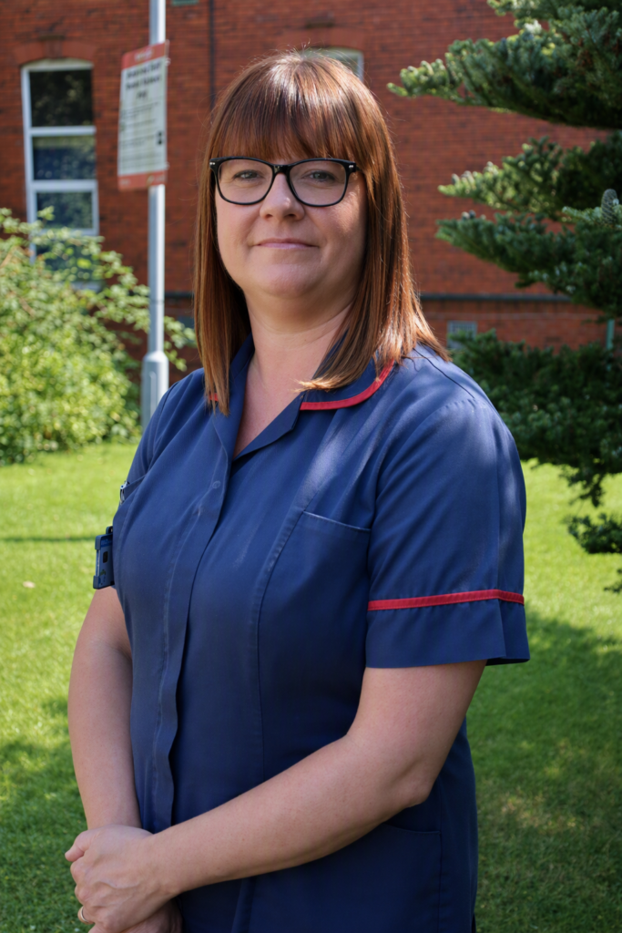 Rebecca Worswick smiles for a photo outside the hospital after being nominated for an award