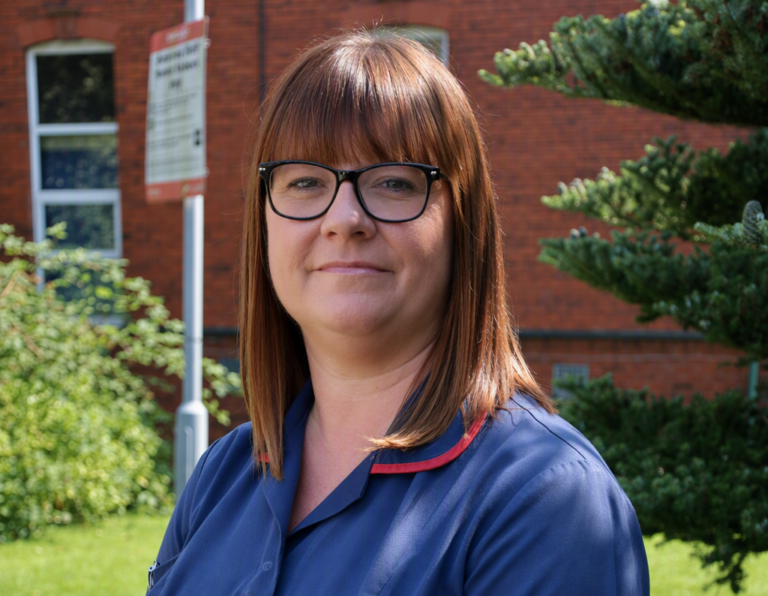 Rebecca Worswick smiles for a photo outside the hospital after being nominated for an award