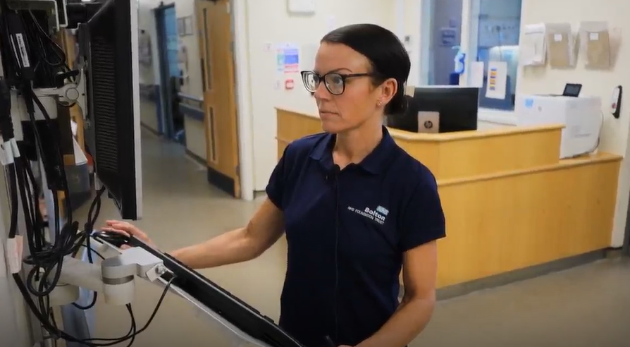 Elaine Brown using computer on ward to complete patient lists