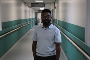Joice Joy standing in a corridor at Royal Bolton Hospital