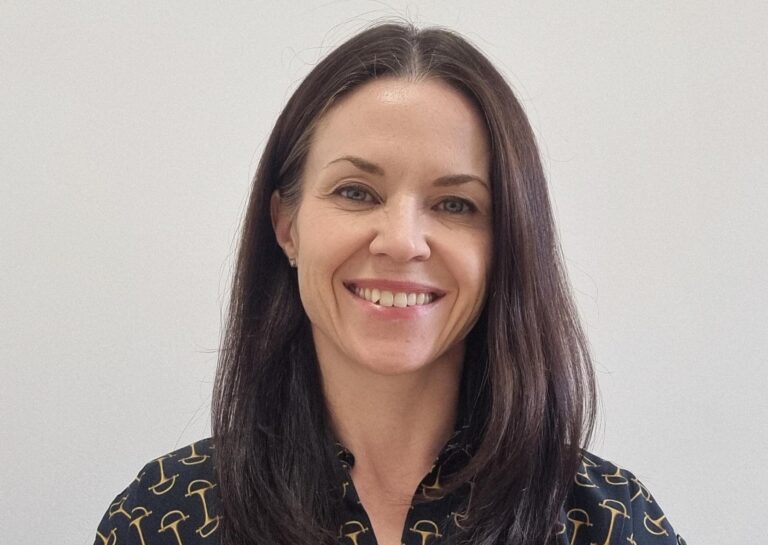 Joanne Downs smiles in portrait photo for new CFO appointment